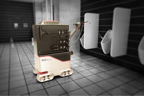 Robot limpia baños utilizando producto químico y agua a presión